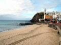 The beach and the church of Morro Jable